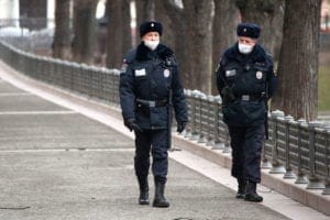 olice officers in face masks patrol the area around Patriarshy Pond in central Moscow