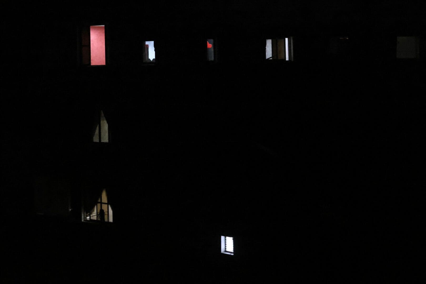 Light shines through a few windows in Gazan building