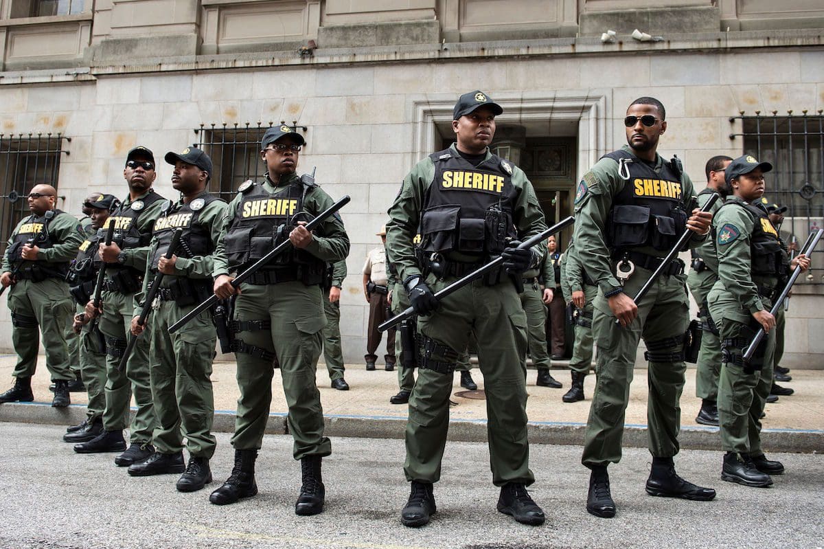 Baltimore County Sheriffs officers gather after Baltimore Officer Caesar Goodson Jr. was acquitted of all charges in his murder trial for the death of Freddie Gray at the Mitchell Court House June 23, 2016 in Baltimore, Maryland. (BRENDAN SMIALOWSKI/AFP/Getty Images)