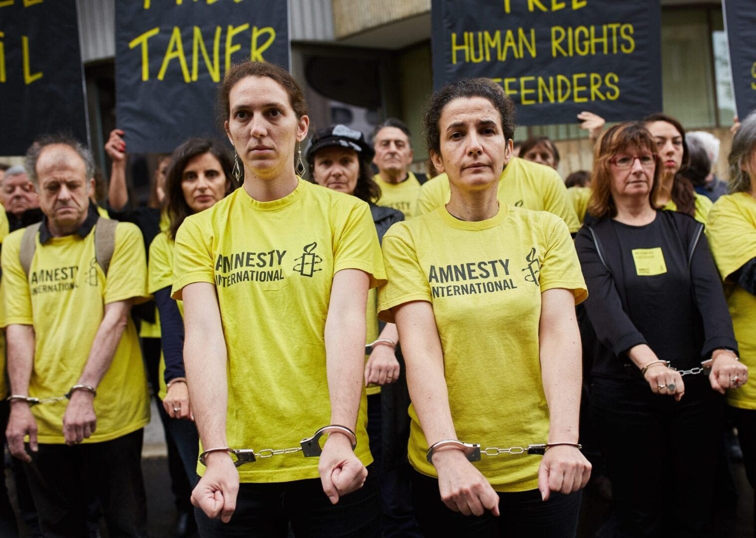 row of human rights defenders in protest