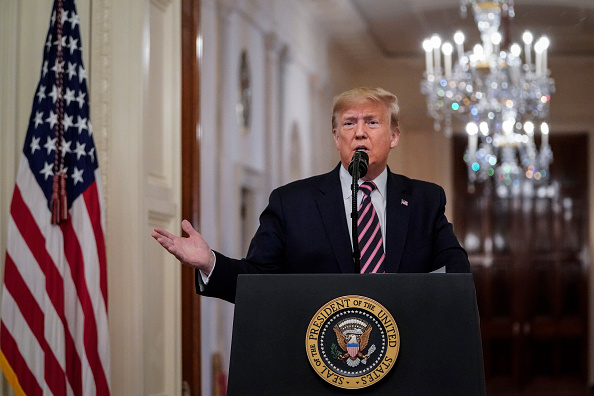 U.S. President Donald Trump speaks to the media in the East Room of the White House