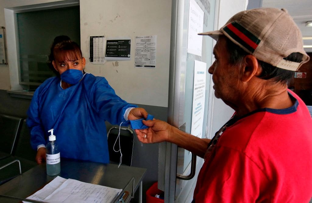 A man receives a mask