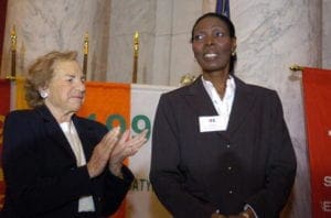 The Director of Dominican Women of Haitian Descent Sonia Pierre (R) is applauded by Ethel Kennedy