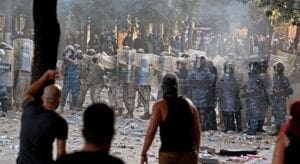 Lebanese security forces hold shields against unarmed protestors