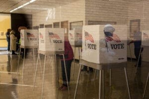 People cast ballots at an early voting polling location for the 2020 Presidential elections in Adel, Iowa, U.S., on Monday, Oct. 5, 2020. President Donald Trump's newfound struggle to keep Iowa in Republican hands, just four years after a comfortable win in the Midwestern state, could also prove decisive for control of the U.S. Senate. Photographer: Rachel Mummey/Bloomberg via Getty Images