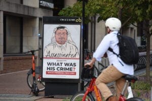 Biker in front of bus stop with the campaign image