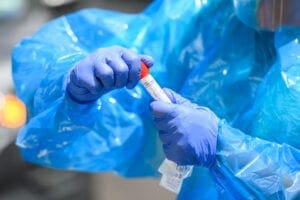 NEW YORK, NEW YORK - JULY 29: A health worker holds a vial while performing a COVID-19 nasal swab test on a friend of the photographer on the Upper West Side as the city continues Phase 4 of re-opening following restrictions imposed to slow the spread of coronavirus on July 29, 2020 in New York City. The fourth phase allows outdoor arts and entertainment, sporting events without fans and media production. (Photo by Noam Galai/Getty Images)