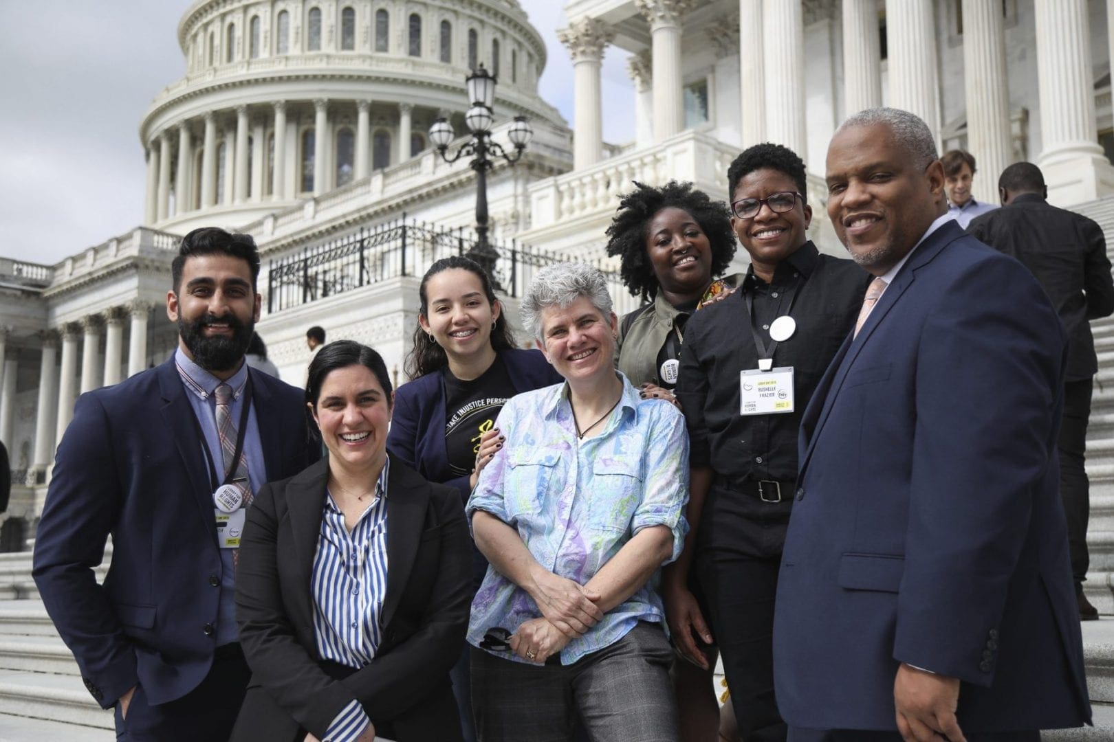 Amnesty members and staff standing in front of the Capitol