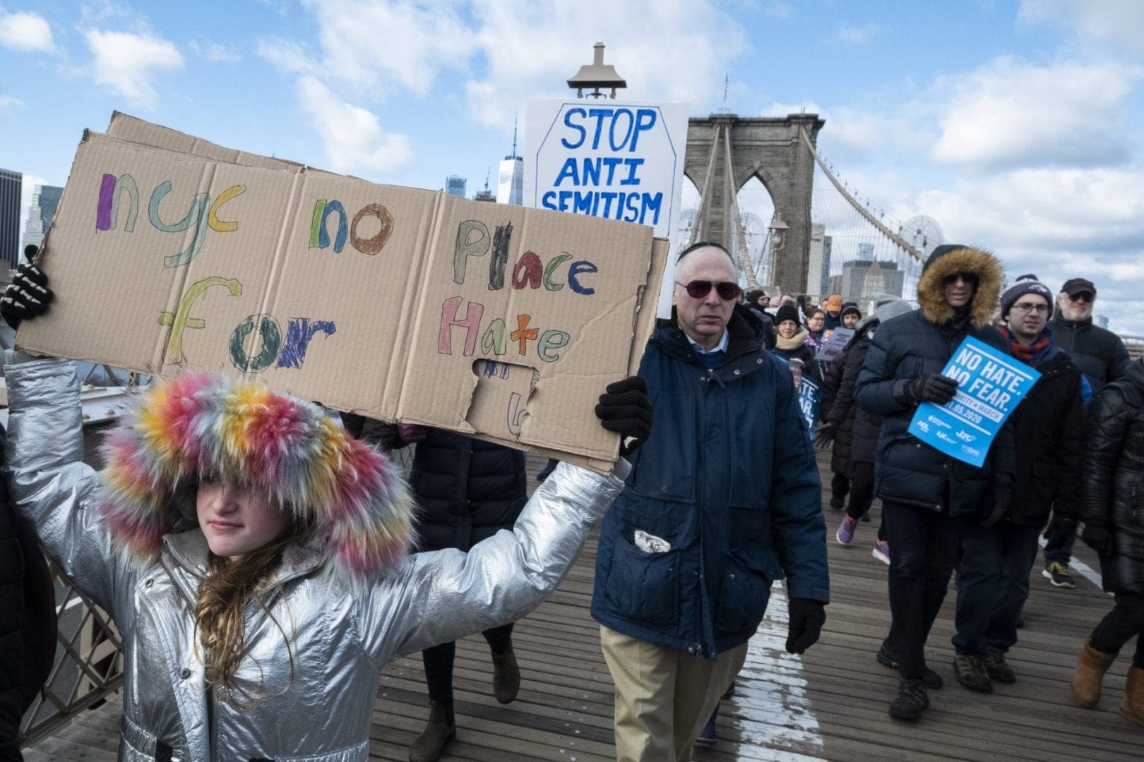 A young marcher hold signs that reads 