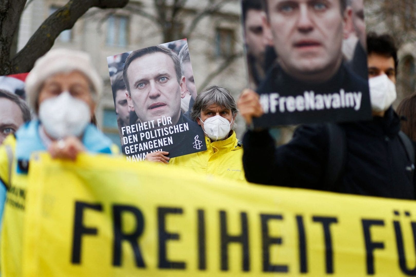 Activists from Amnesty International demonstrate outside the Russian embassy in Berlin