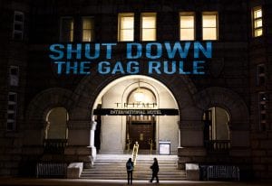 Building projection reads "shut down gag rule"