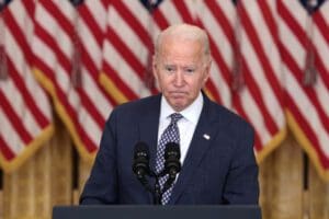 Biden stands in front of United States flag