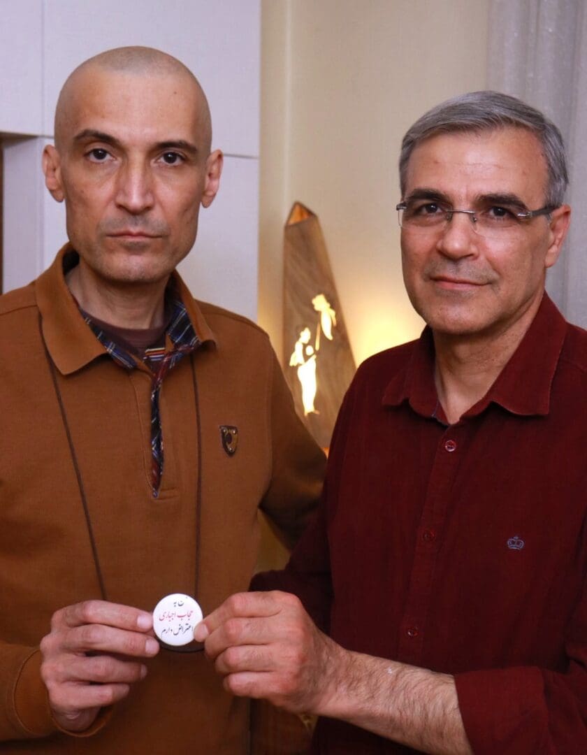 Farhad Meysami and Reza Khandan with button