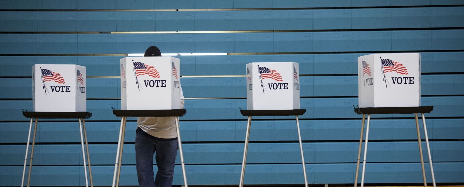 man at voting booth