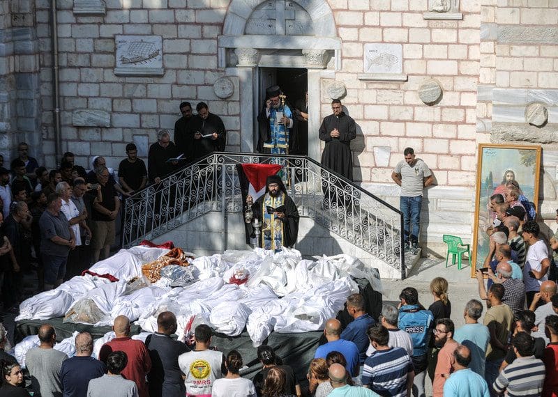 People attend the funeral ceremony for victims who lost their lives in Israeli attack on Church of Saint Porphyrius in Gaza City, Gaza on October 20, 2023.