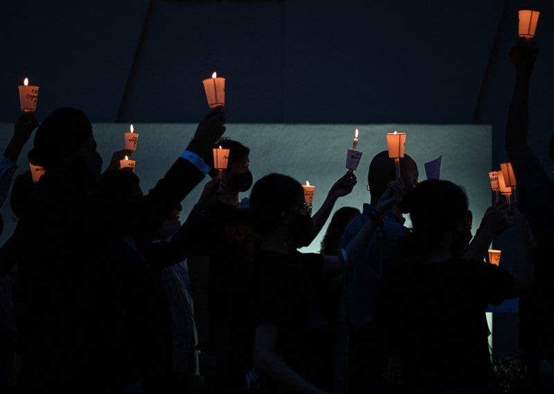 Activists attend a candlelight vigil against the impending execution of Malaysian citizen, Nagaenthran K. Dharmalingam whoe was sentenced to death for trafficking heroin into Singapore.