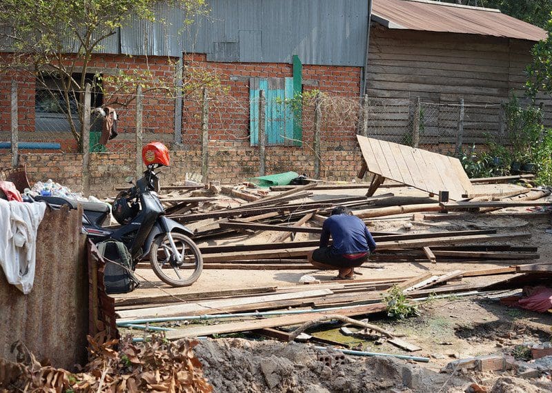 Photo from a March 2023 research mission to Siem Reap, Cambodia where Amnesty has deemed “voluntary” evictions at the Angkor Wat temples to be forced. The government is claiming it needs to move people to keep the site’s status as a World Heritage site. This image shows a man dismantling his house in order to move to the relocation site.