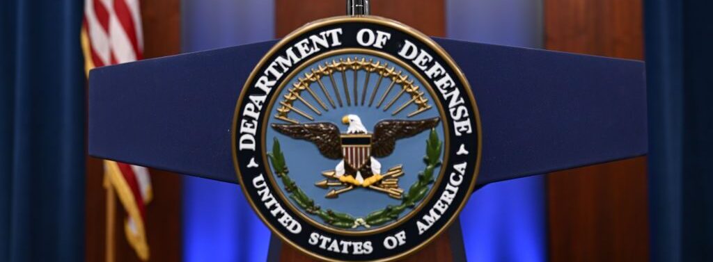 Department of Defense and Pentagon logos are seen ahead of a press conference