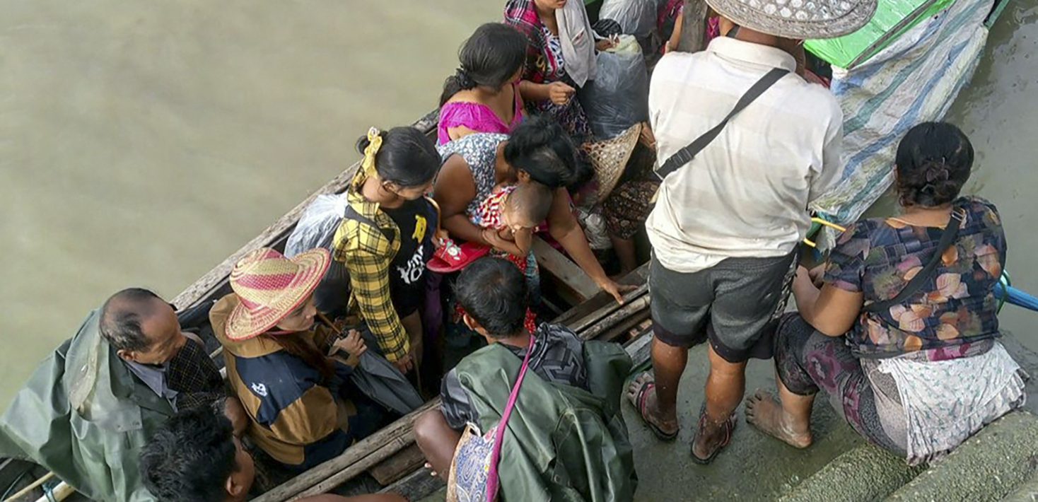 Myanmar citizens crowded on a small boat