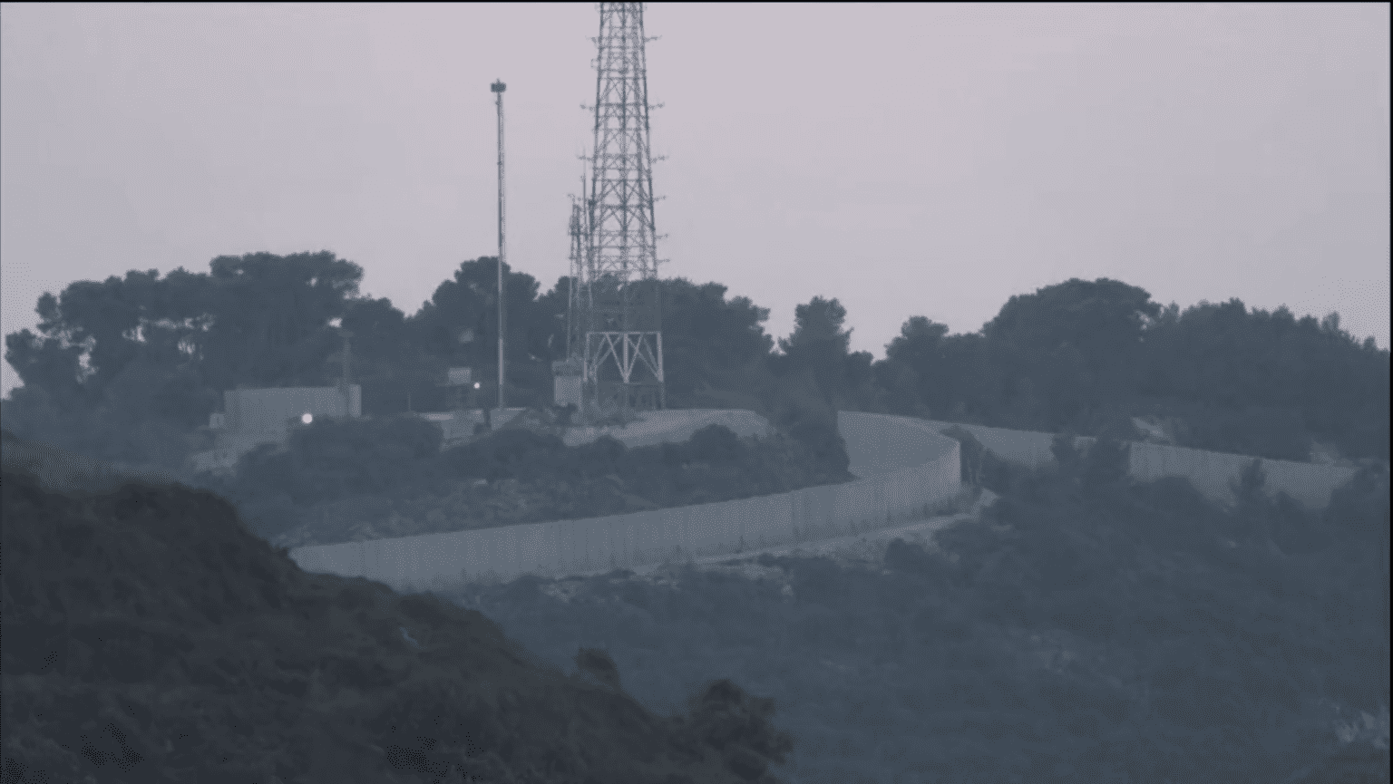 Screengrab from the journalists’ cameras filming an Israeli military post on the border with Lebanon. Footage from three different cameras captured Israeli military infrastructure, such as a watch tower and antennae, and an Israeli Merkava tank firing towards the area of El-Dabche in Lebanon. ©AFP