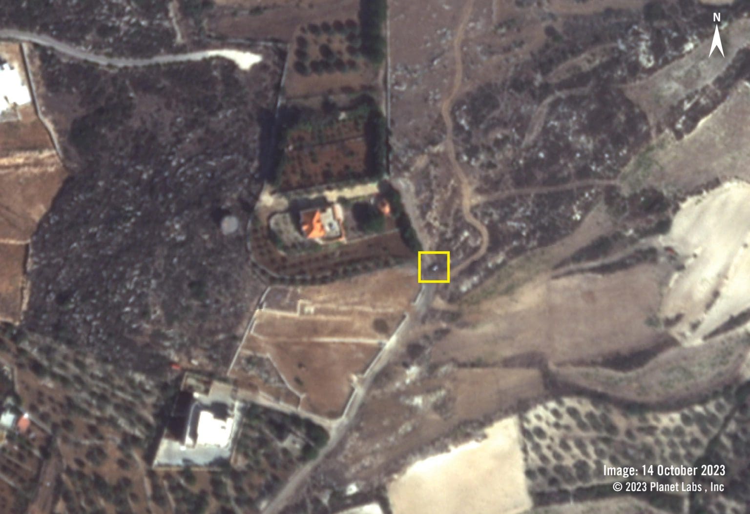 Satellite imagery from 14 October shows the burned vehicle on the road (yellow square).