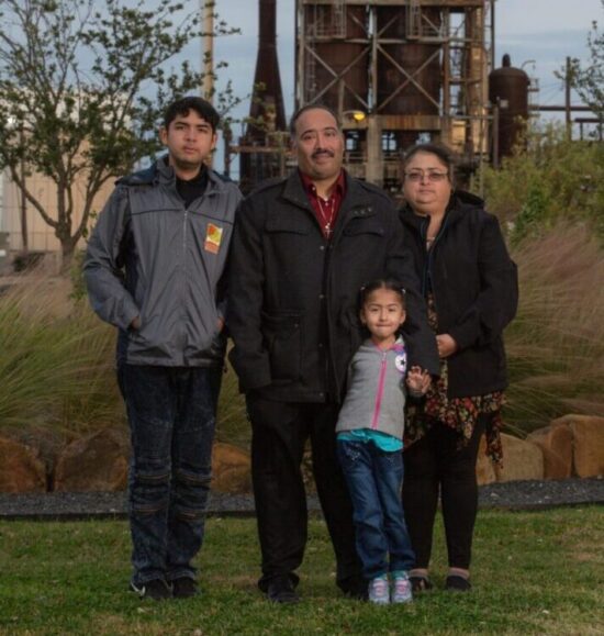 Juan Flores, his wife Maria, and children Dominique and Jean at their home near the Houston Ship Channel in Texas. (photo supplied by family)
