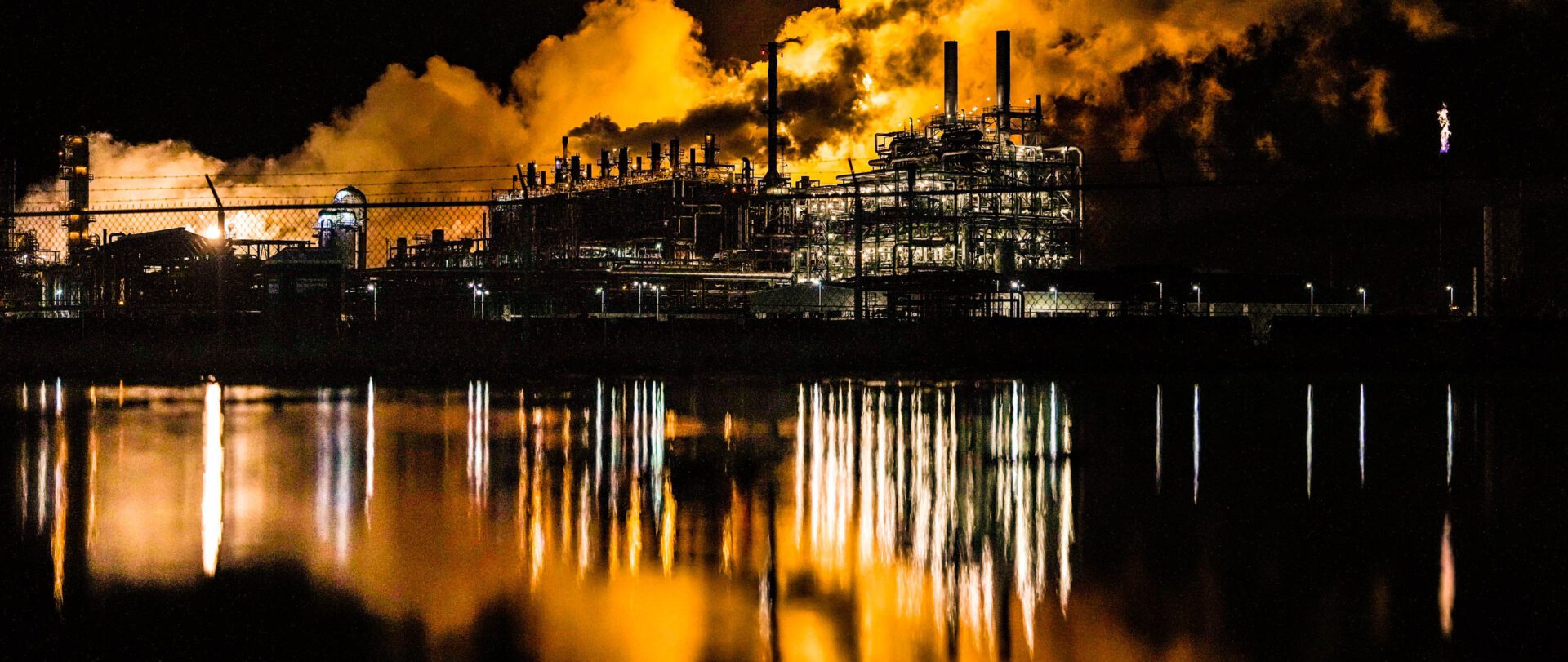 Black smoke and fire caused by flaring, or the controlled burning of substances, and often associated with toxic emissions and low air quality, coming out of a plant near the Houston Ship Channel in 2023 (Raquel Natalicchio/Houston Chronicle via Getty Images)