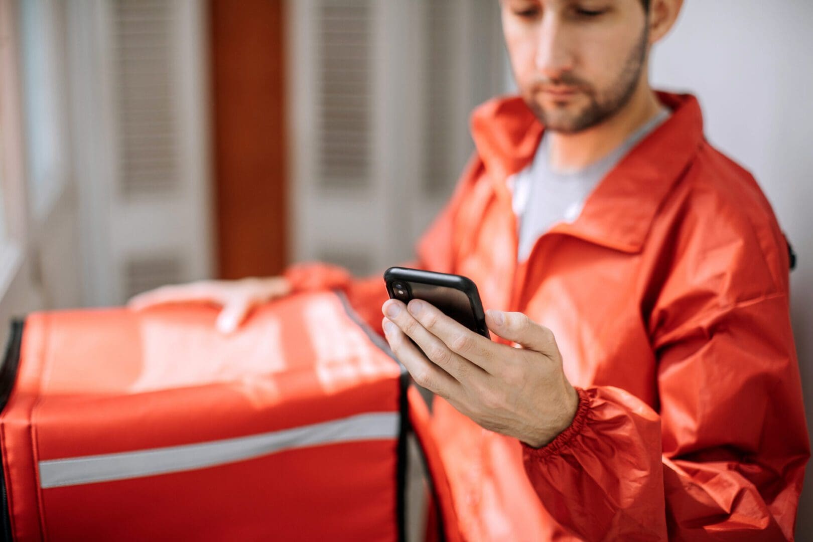 Food delivery man getting ready for work