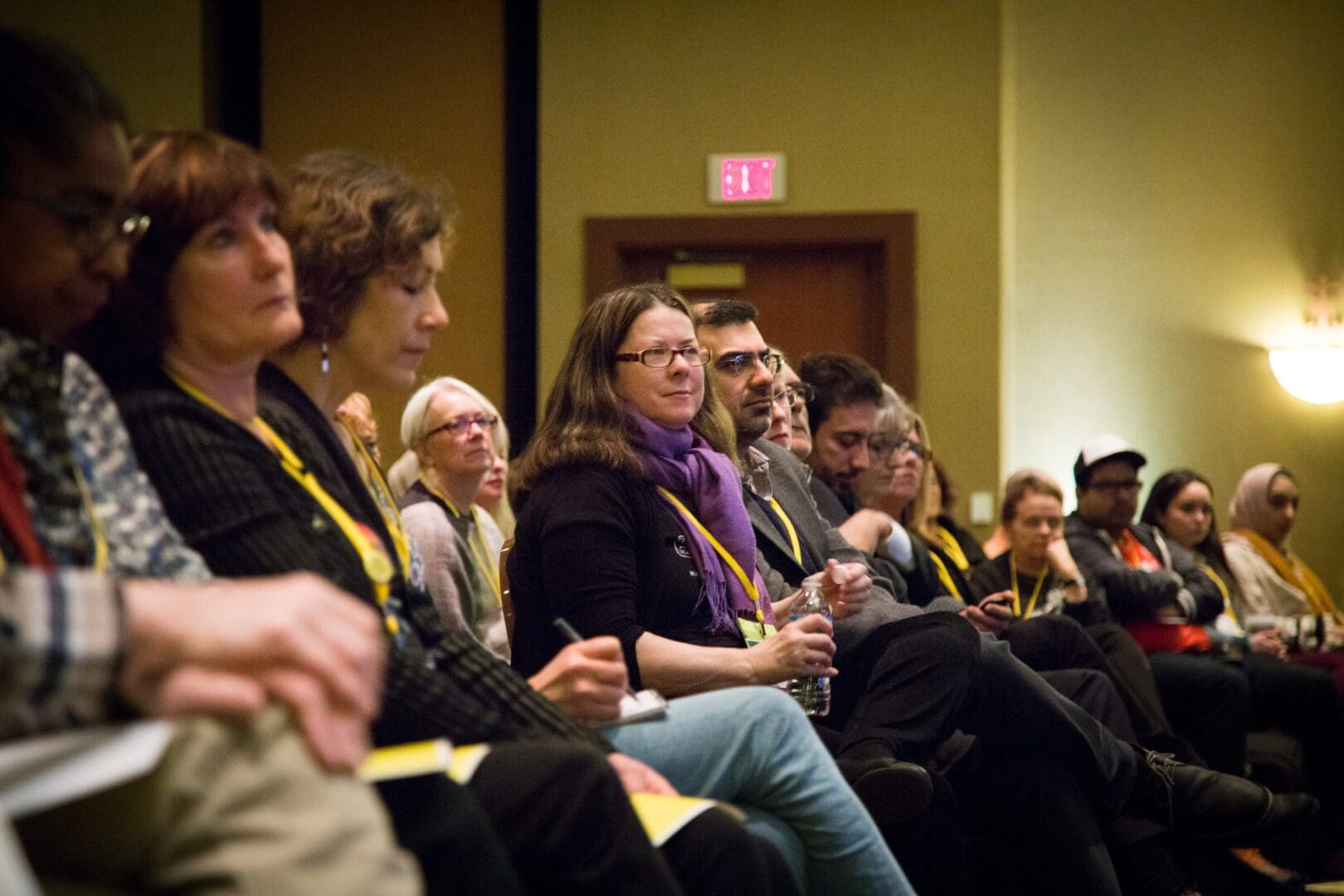 Row of people sitting in a conference room