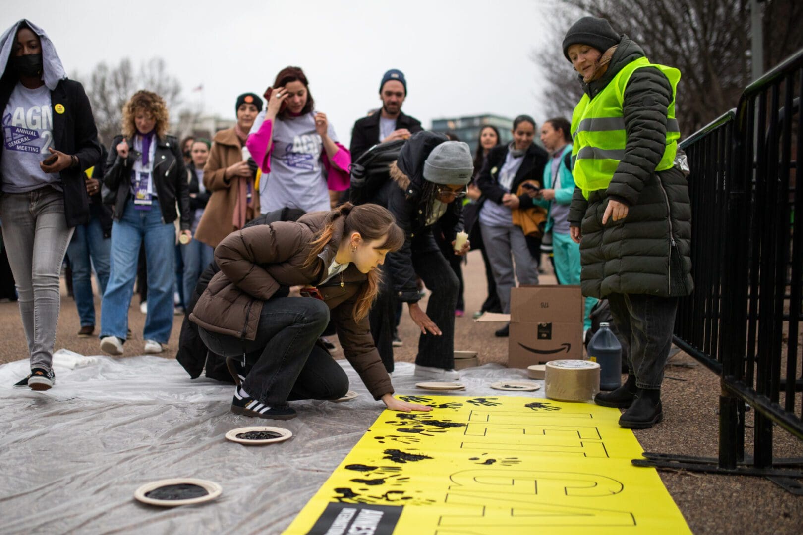 Amnesty International USA protesters leave handprint on Let Gaza Live banner