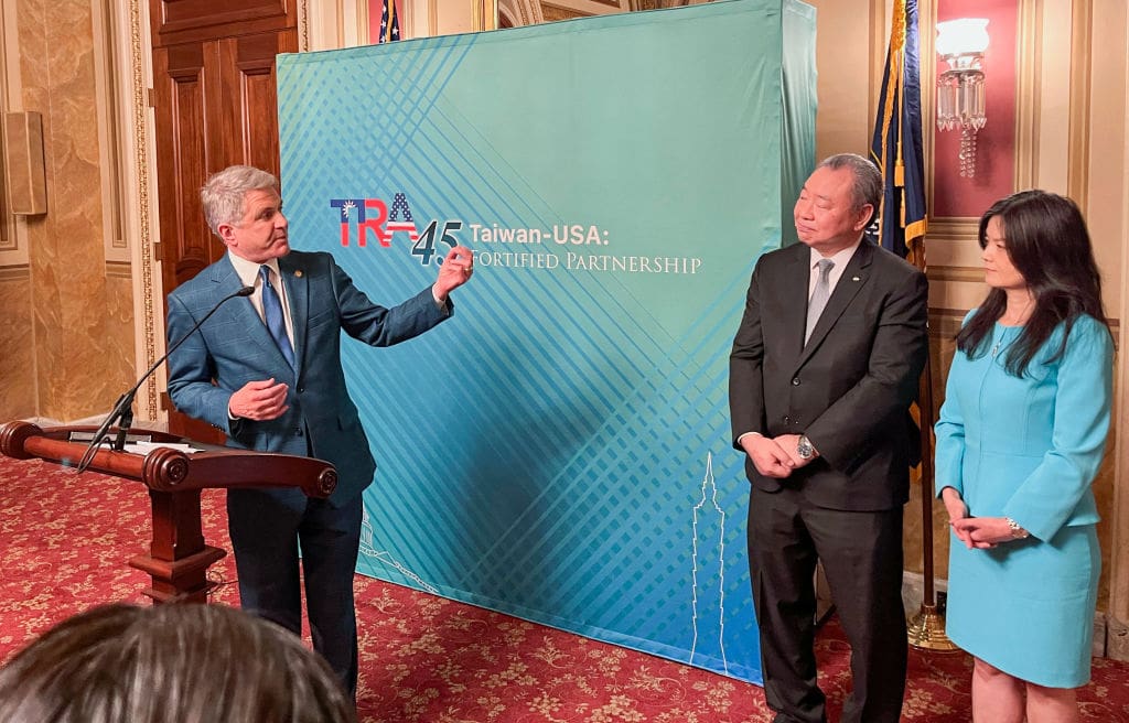 Representative Mike McCaul (L), the chairman of the House Foreign Affairs Committee, addresses an event alongside Taiwan's representative in Washington, Alexander Tah-Ray Yui (C), and Yui's wife Karen Lo at the US Capitol marking the 45th anniversary of the Taiwan Relations Act on March 6, 2024. McCaul, who was hit by sanctions by China over his last visit, said he would return to Taiwan to attend the inauguration of President-elect Lai Ching-te. (Photo by Shaun TANDON / AFP) (Photo by SHAUN TANDON/AFP via Getty Images)