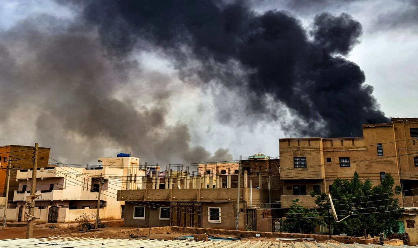 Smoke plumes billow from a fire at a lumber warehouse in southern Khartoum amidst ongoing fighting on June 7, 2023.
