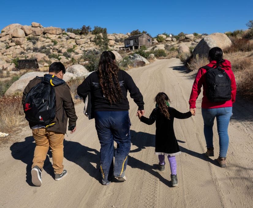 JACUMBA HOT SPRINGS, CALIFORNIA - SEPTEMBER 22: Colombian asylum seekers walk through the desert after crossing the U.S.-Mexico on September 22, 2024 near Jacumba Hot Springs, California. Immigrant border crossings remain low months after the Biden Administration's executive order banning most asylum claims at the southern border. The issues of asylum and illegal immigration remain motivating topics for voters ahead of the upcoming U.S. election. (Photo by John Moore/Getty Images)