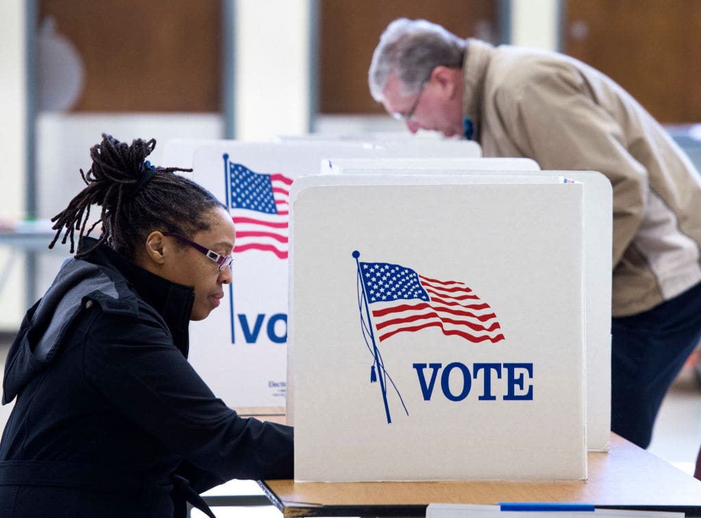 People vote in the Super Tuesday primary at Centreville High School March 1, 2016, in Centreville, Virginia. Voters in a dozen states will take part in