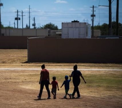 family walking near Dilley detention center