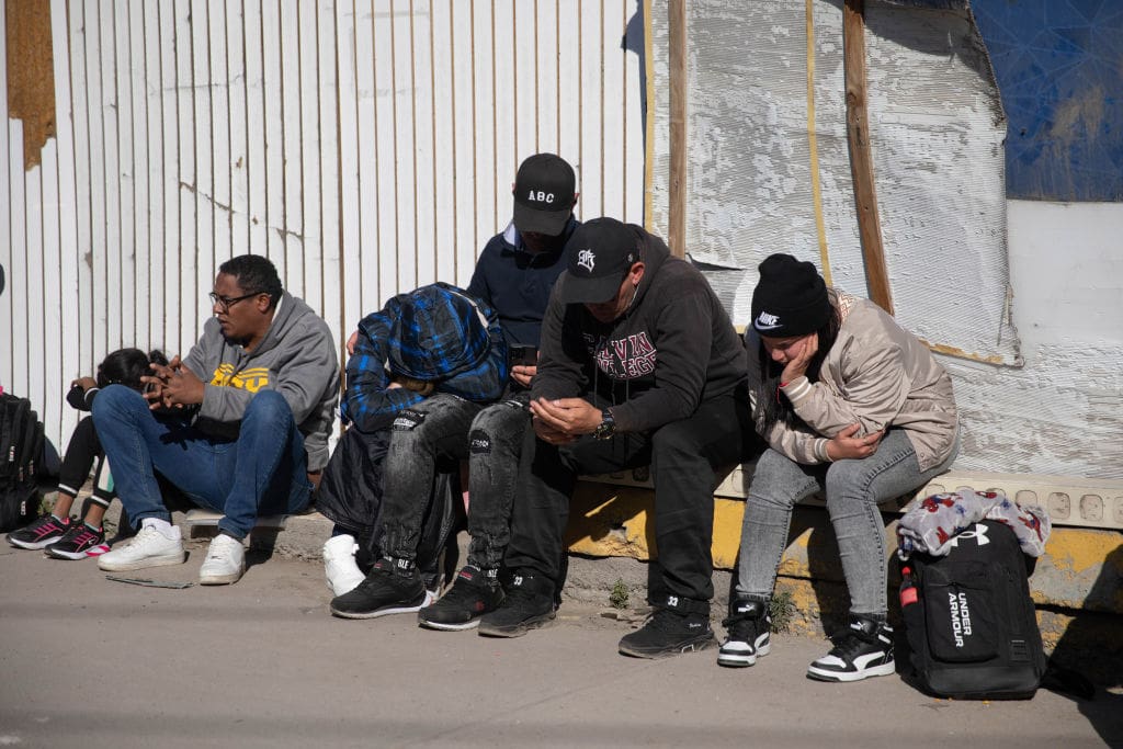 MEXICO CITY, MEXICO - JANUARY 27: Migrants line up as they wait to enter the Mexican Commission for Refugee Assistance (COMAR) in Mexico City, Mexico on January 27, 2025. Hundreds of migrants of various nationalities such as Haiti, Venezuela and Honduras line up outside the Mexican Commission for Refugee Assistance (COMAR) as they wait to regularize their migratory status in Mexico after US President Donald Trump's executive orders on Immigration. (Photo by Daniel Cardenas/Anadolu via Getty Images)
