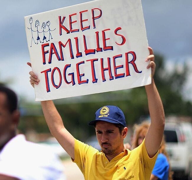DORAL, FL - MAY 22: Pablo Terraza holds a sign reading, 