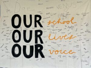 AIUSA Washtenaw International High School group banner our school, our lives, our voice