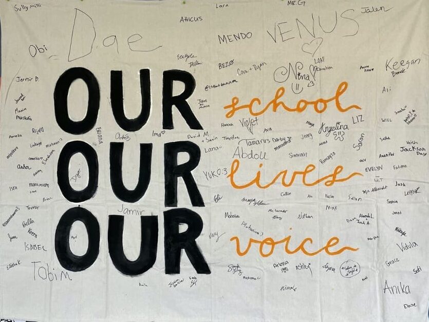 AIUSA Washtenaw International High School group banner our school, our lives, our voice