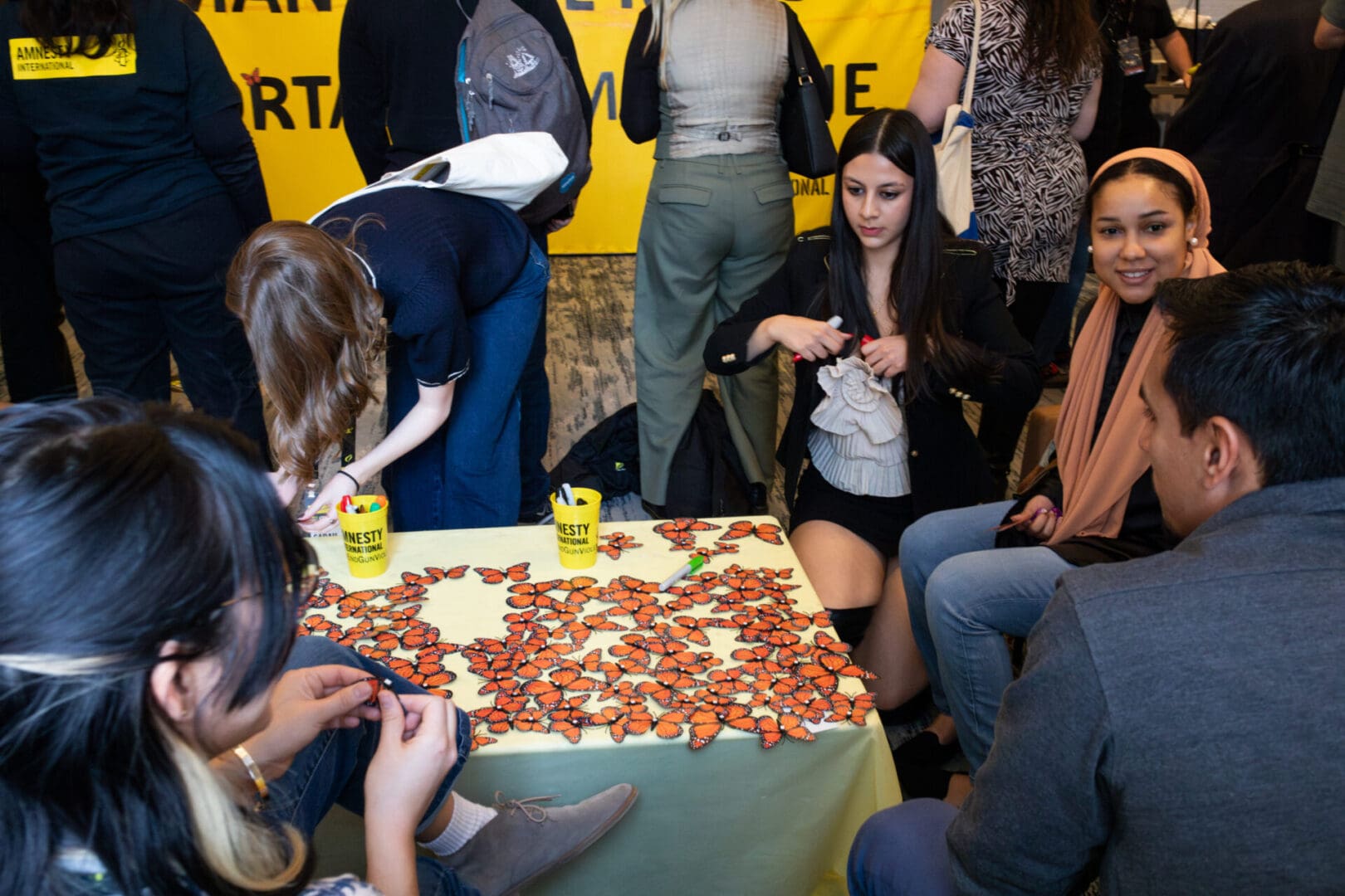 Members signed their names and left short letters of hope on paper monarch butterflies, which represent the resilience of immigrants and the human right of all living beings to move freely.