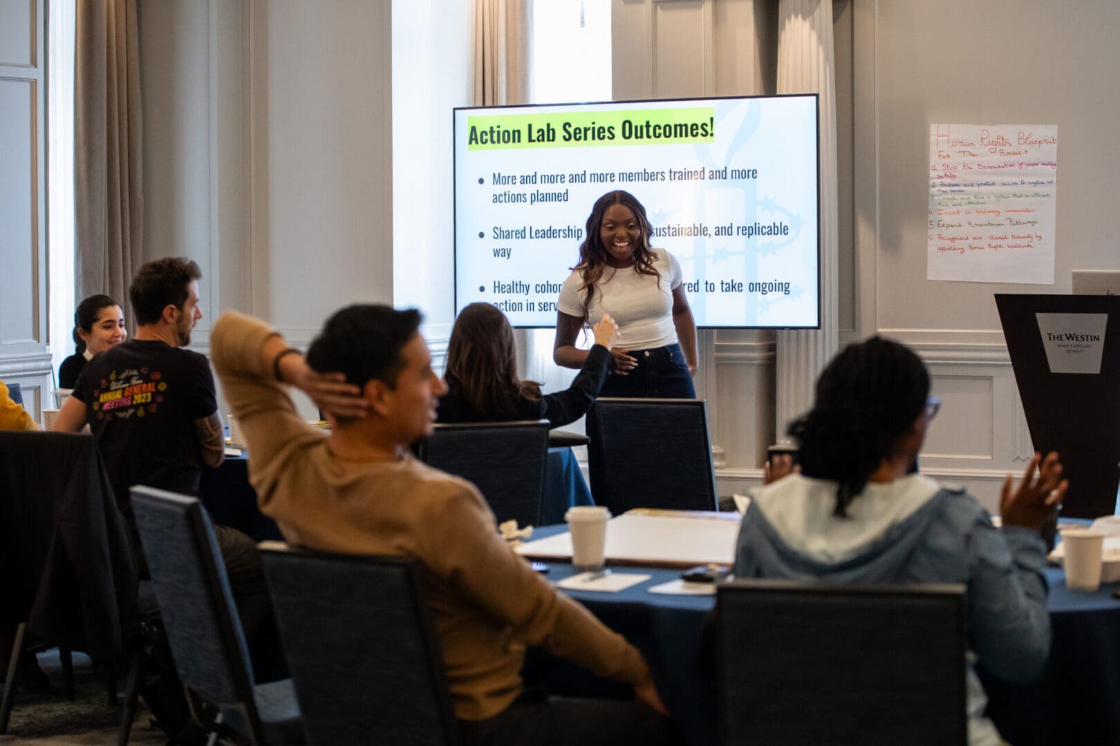 Arielle Newton, AIUSA Senior Organizer pictured with a group of passionate members, discussing the goals of the Campaign.