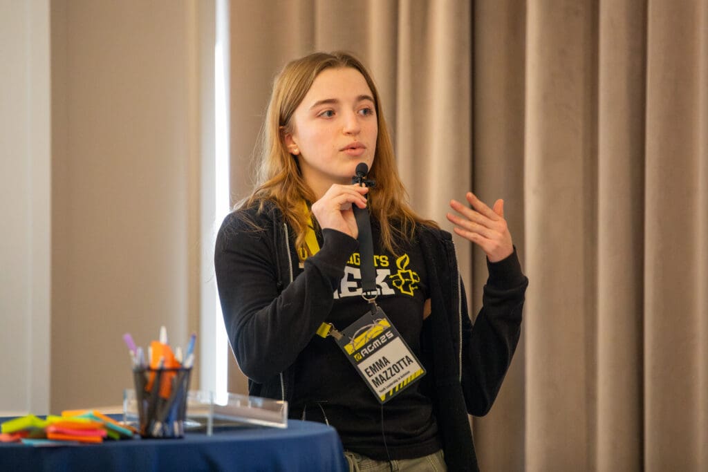 Emma Mazzotta, AIUSA Student Activist Coordinator speaking during session.