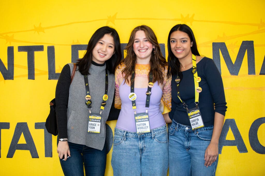 Shreya Halbe AIUSA Social Media Manager for Youth Leadership & Activism (pictured on the right) next to other student attendees.