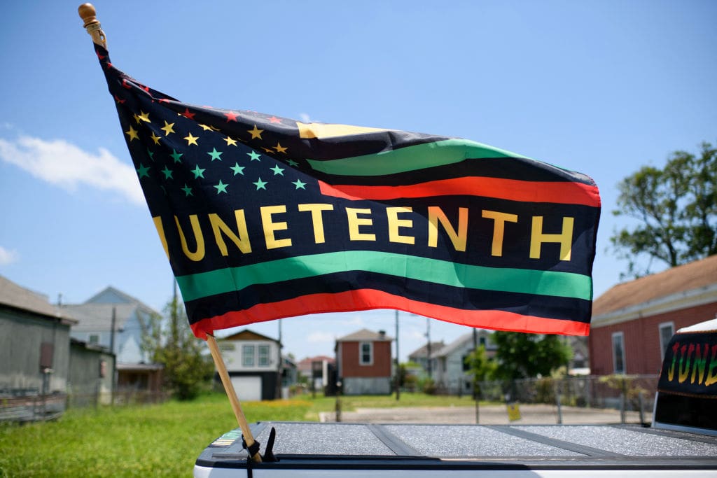 A Juneteenth flag flies on a float during the 45th annual Juneteenth National Independence Day celebrations in Galveston, Texas, on June 15, 2024. Juneteenth falls on June 19 and has often been celebrated on the third Saturday in June, to mark the end of slavery in the US.