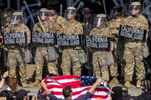 Protesters confront California National Guard soldiers and police outside of a federal building as protests continue in Los Angeles following three days of clashes with police after a series of immigration raids on June 09, 2025 in Los Angeles, California.