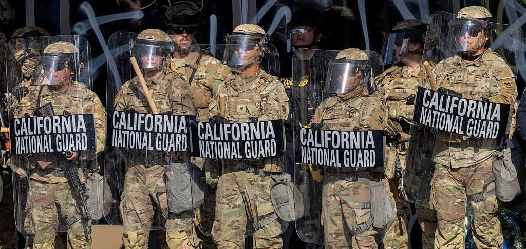 Protesters confront California National Guard soldiers and police outside of a federal building as protests continue in Los Angeles following three days of clashes with police after a series of immigration raids on June 09, 2025 in Los Angeles, California.