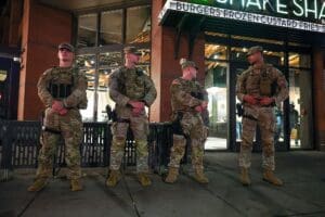 WASHINGTON, DC - AUGUST 24: National Guard Members patrol 14th street, working with Washington DC Metro police on August 24, 2025 in Washington, DC. An increased presence of law enforcement has been seen throughout the nation's capital since U.S. President Donald Trump ordered in federal officers and the U.S. National Guard.