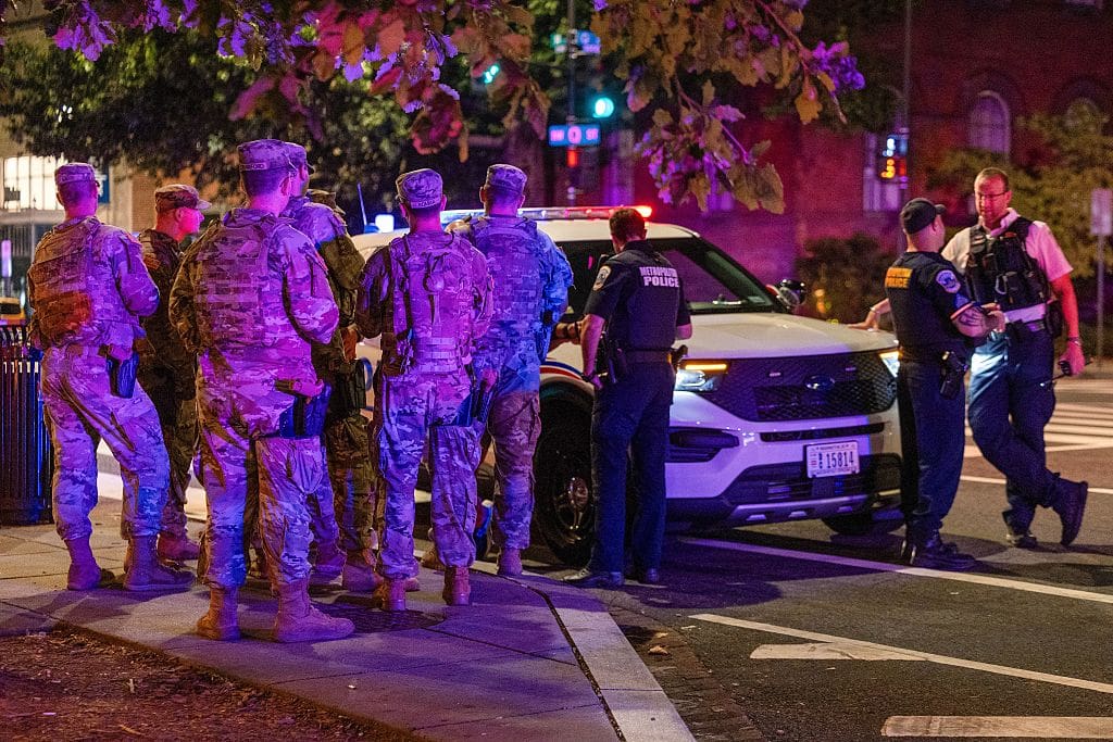 WASHINGTON, DC - AUGUST 25: National Guard Members patrol 14th Street, working alongside Washington DC Metro police and the FBI on August 25, 2025 in Washington, DC. An increased presence of law enforcement has been seen throughout the nation's capital since U.S. President Donald Trump ordered in federal officers and the U.S. National Guard.