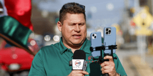 reporter mario guevara holding a mic