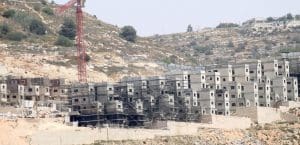 illegal settlements in Occupied Palestinian Terriroty being built with scaffolding